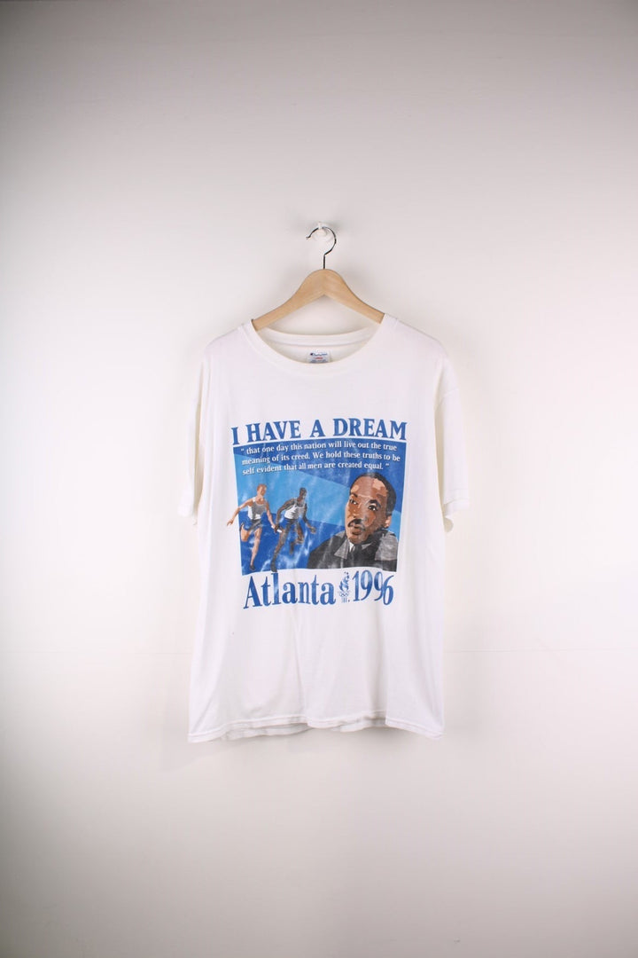 Champion 1996 Atlanta Olympics Martin Luther King Jr T-Shirt in a white colourway with the 'I Have a Dream' quote printed on the front alongside a graphic print of runners and Martin Luther King Jr.