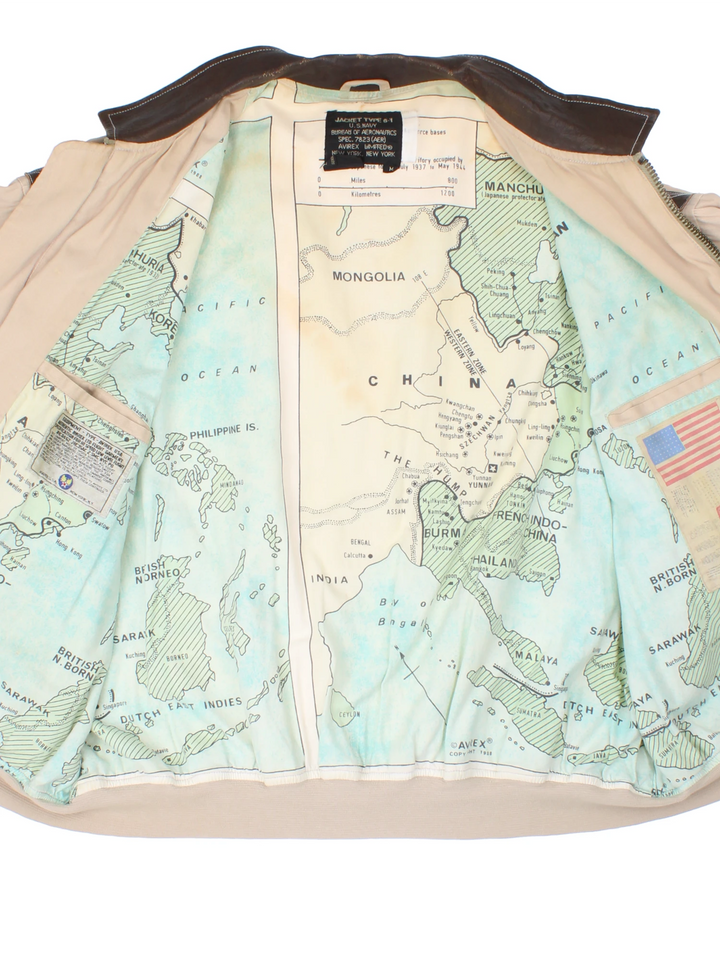 Vintage Avirex type G-1 tan cotton flight jacket with all over printed details and embroidered badge on the pocket