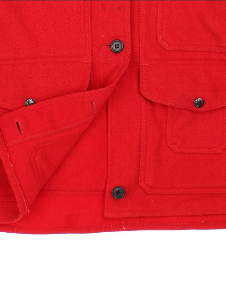 Vintage 70's Filson Mackinaw Cruiser Jacket in a red colourway, buttons up and has multiple pockets, including a big pouch pocket on the back.