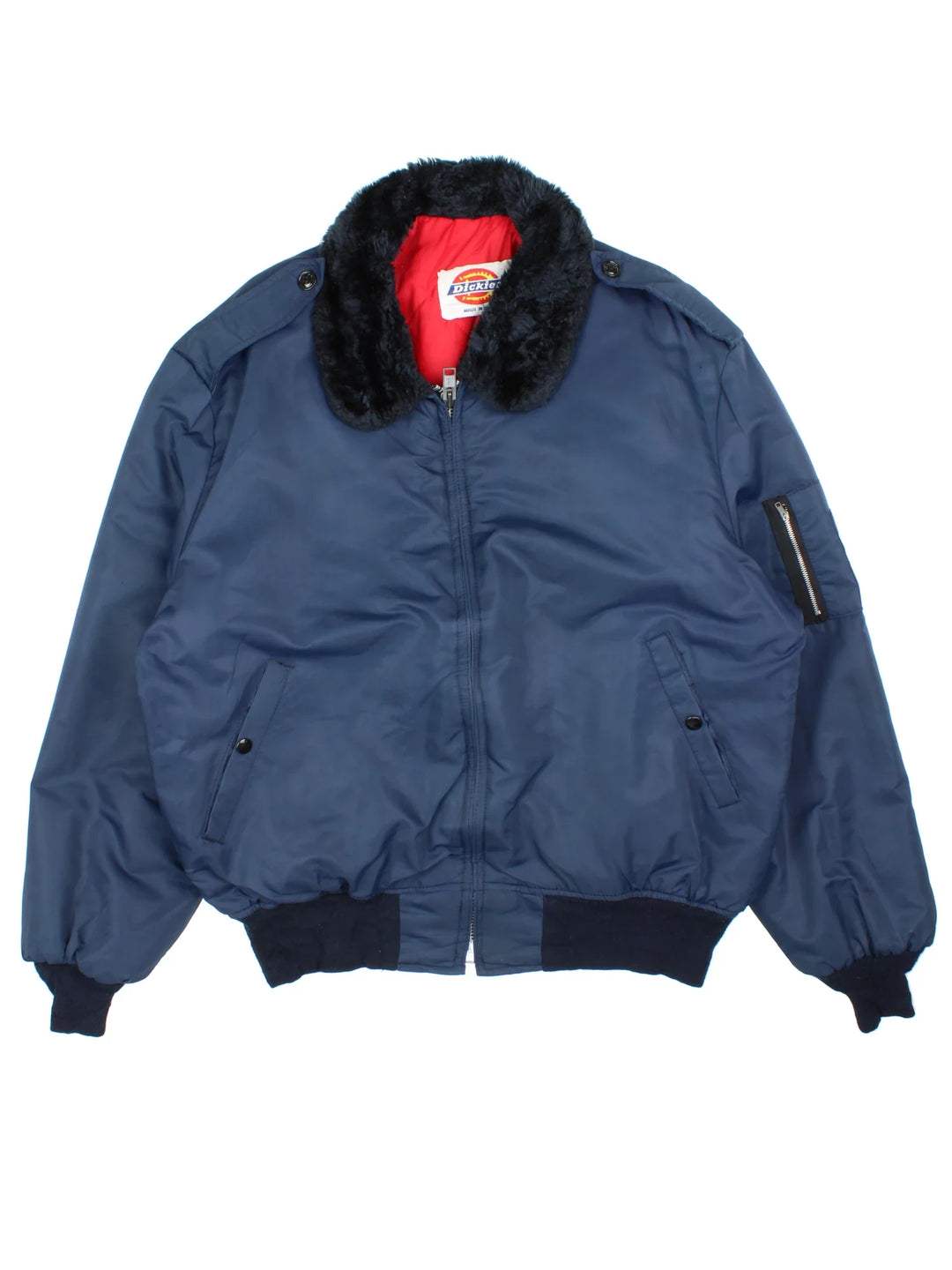 90's Dickies Bomber Jacket in a blue colourway. Zips up and has multiple pockets, insulated with a quilted lining, and a faux fur collar.