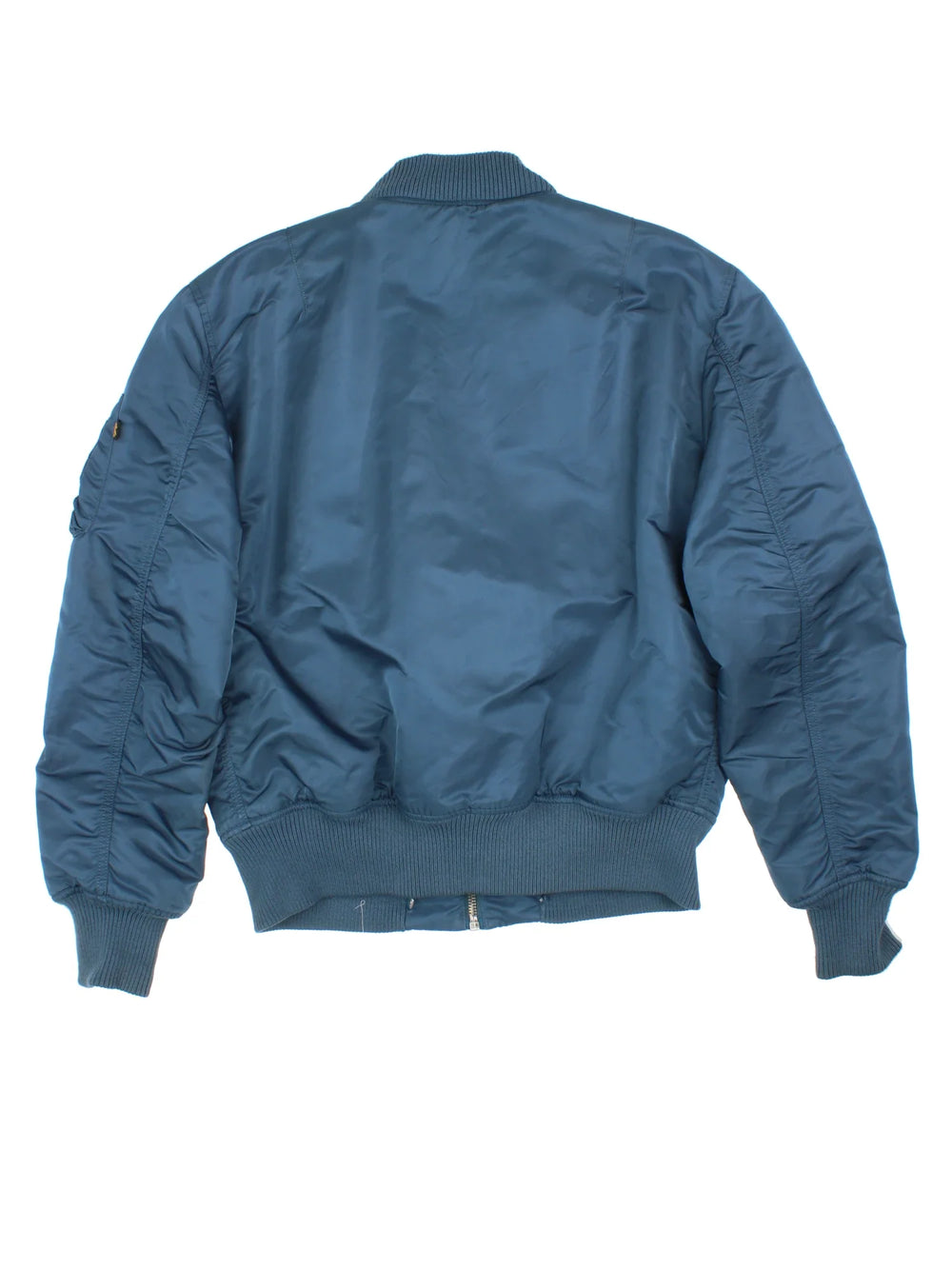 Alpha Industries Bomber Jacket in a blue colourway. Zips up and has multiple pockets, insulated with a quilted lining, and has velcro patch logo on the front.