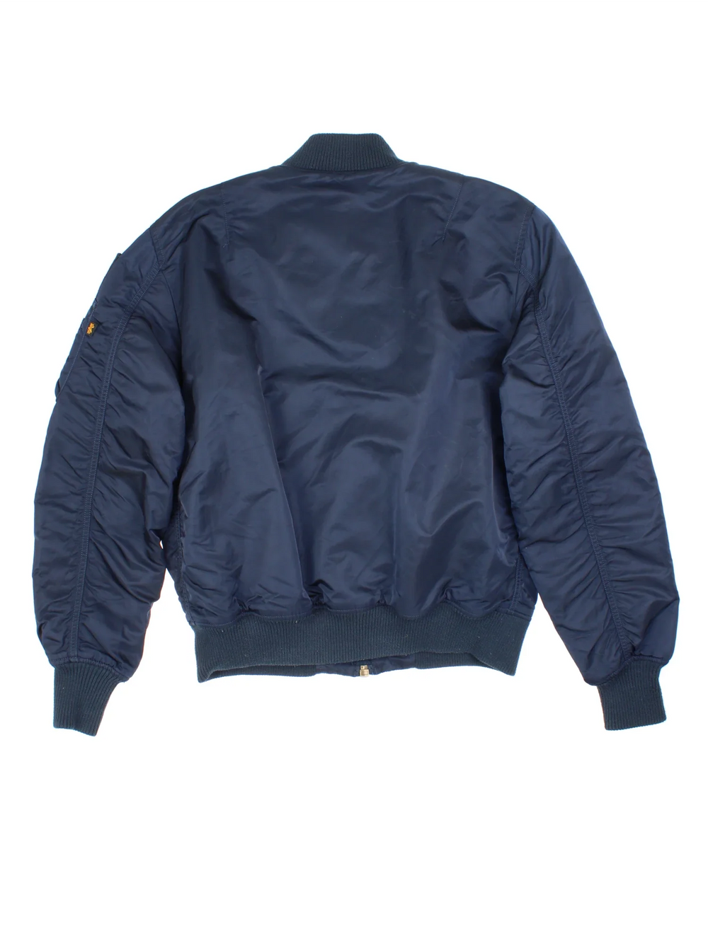 Alpha Industries NASA Bomber Jacket in a blue colourway. Zips up and has multiple pockets, insulated lining, and has the logo embroidered on the front and left sleeve.