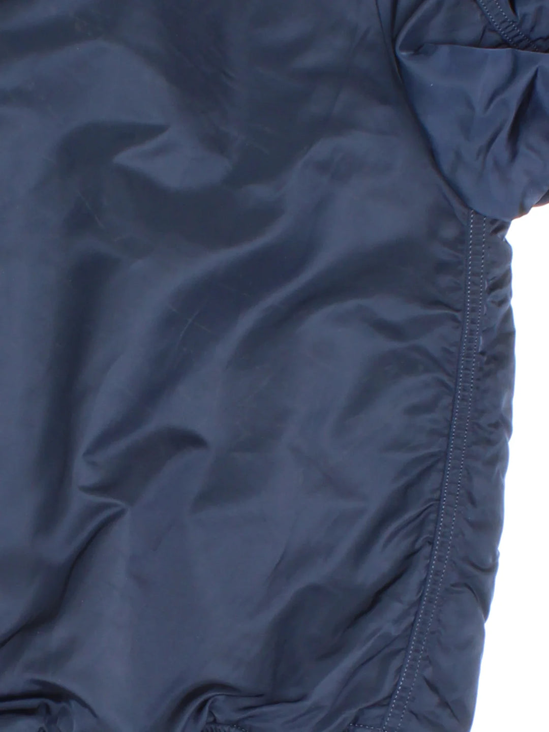 Alpha Industries NASA Bomber Jacket in a blue colourway. Zips up and has multiple pockets, insulated lining, and has the logo embroidered on the front and left sleeve.