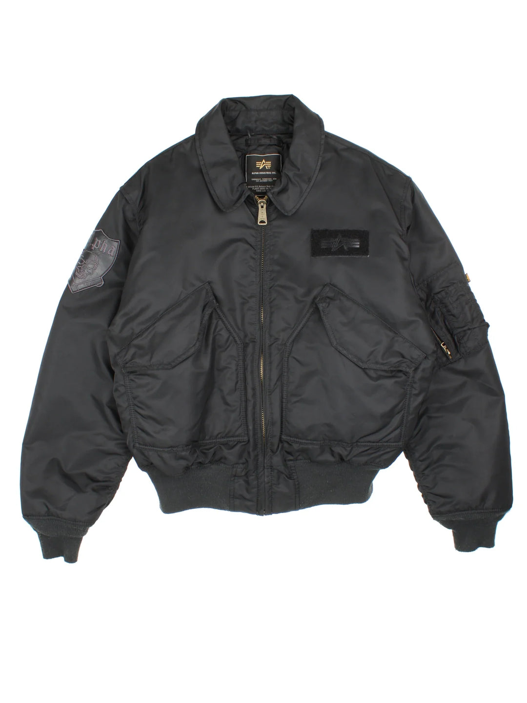 Alpha Industries Embroidered Skull Bomber Jacket in a black colourway. Zips up and has multiple pockets, insulated lining, and has the logo embroidered on the front/sleeve and on the back a big skull graphic embroidered alongside spell out.