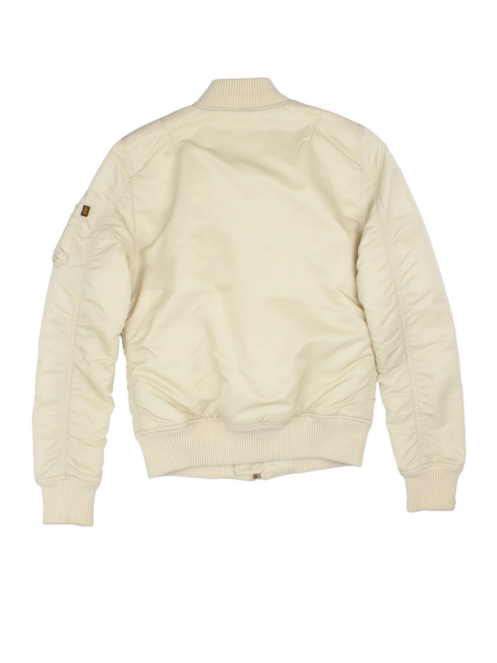 Alpha Industries Bomber Jacket in a tan colourway. Zips up and has multiple pockets, insulated lining, and has the logo tab embroidered on the left sleeve pocket.
