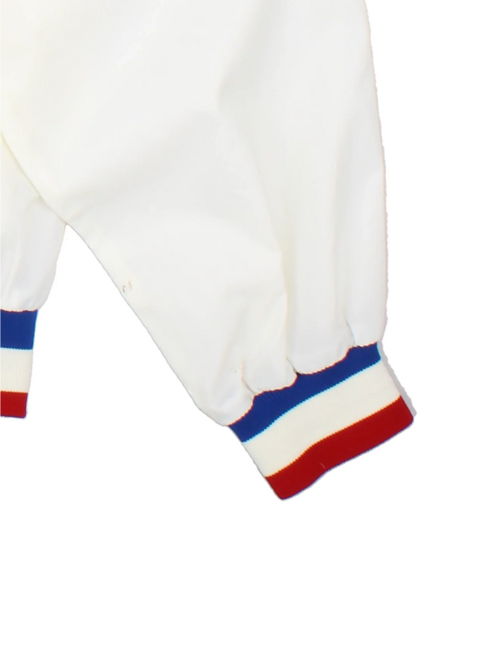 1990 NFL Super Bowl Nylon Jacket in a white colourway. Zips up and has side pockets, and the logo embroidered on the front.