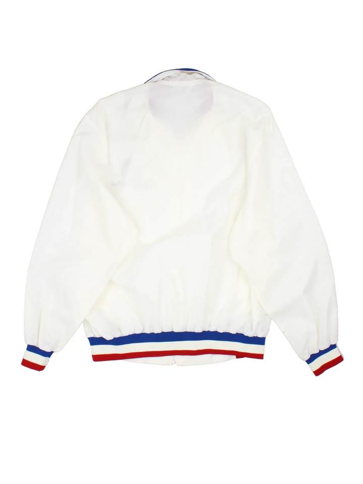 1990 NFL Super Bowl Nylon Jacket in a white colourway. Zips up and has side pockets, and the logo embroidered on the front.
