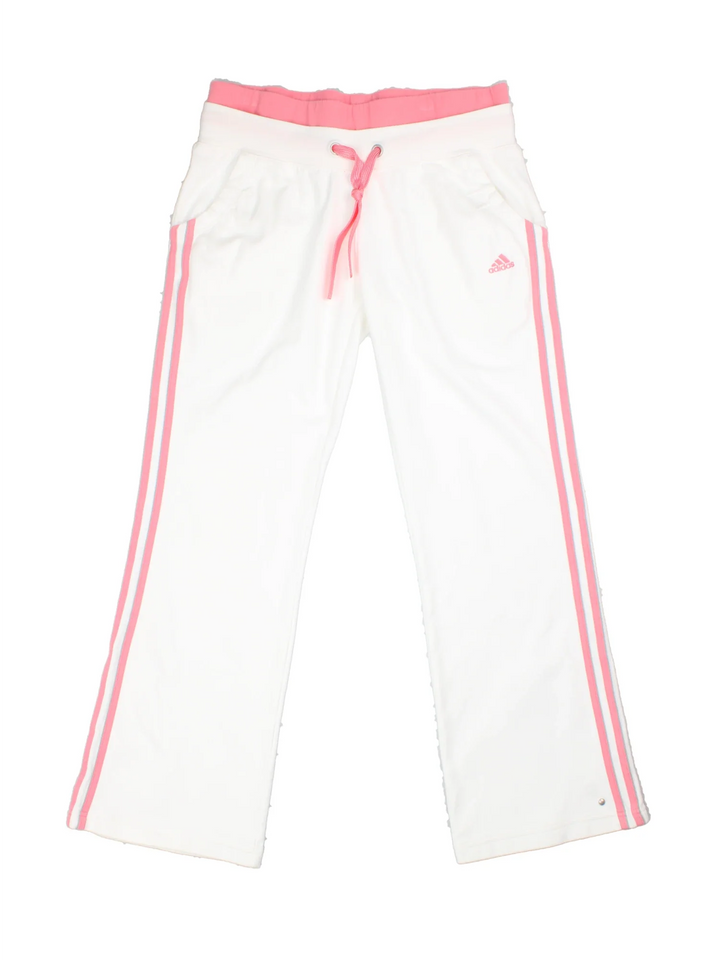 Adidas Tracksuit Bottoms in white and pink colourway with front pockets, adjustable waist with drawstring, and the logo embroidered on the front.