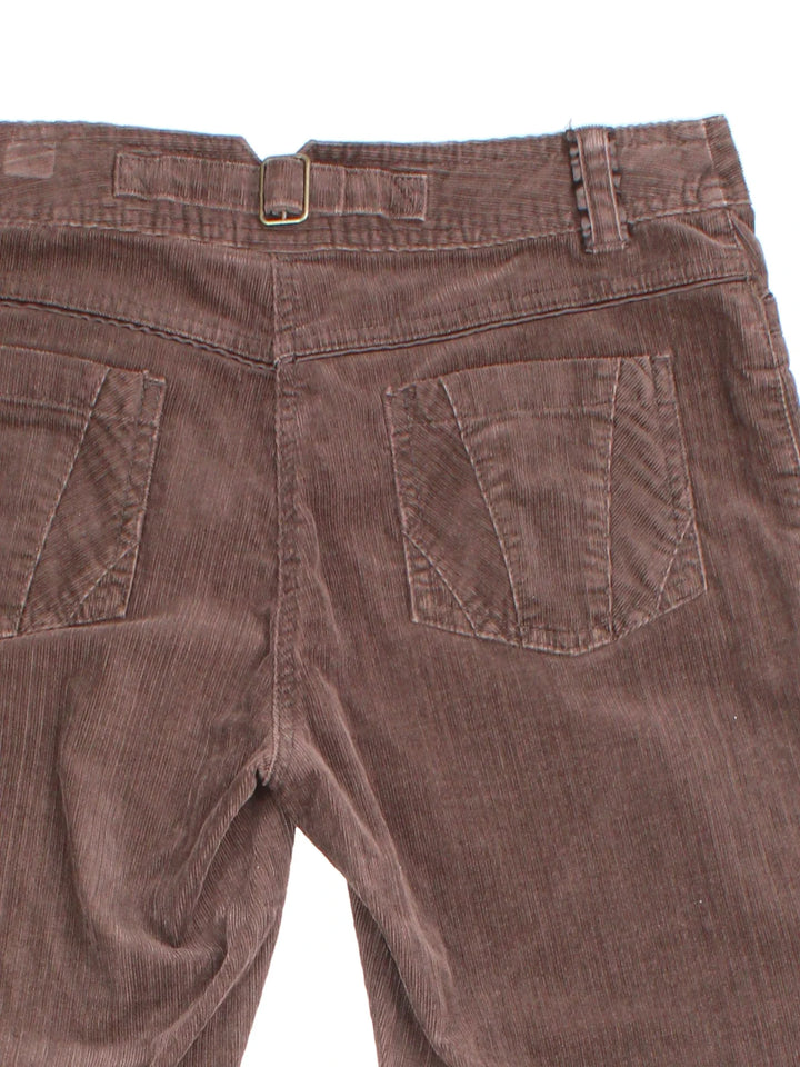 Y2K Next Corduory Trousers in a brown colourway with multiple pockets and buckle detail on the back.