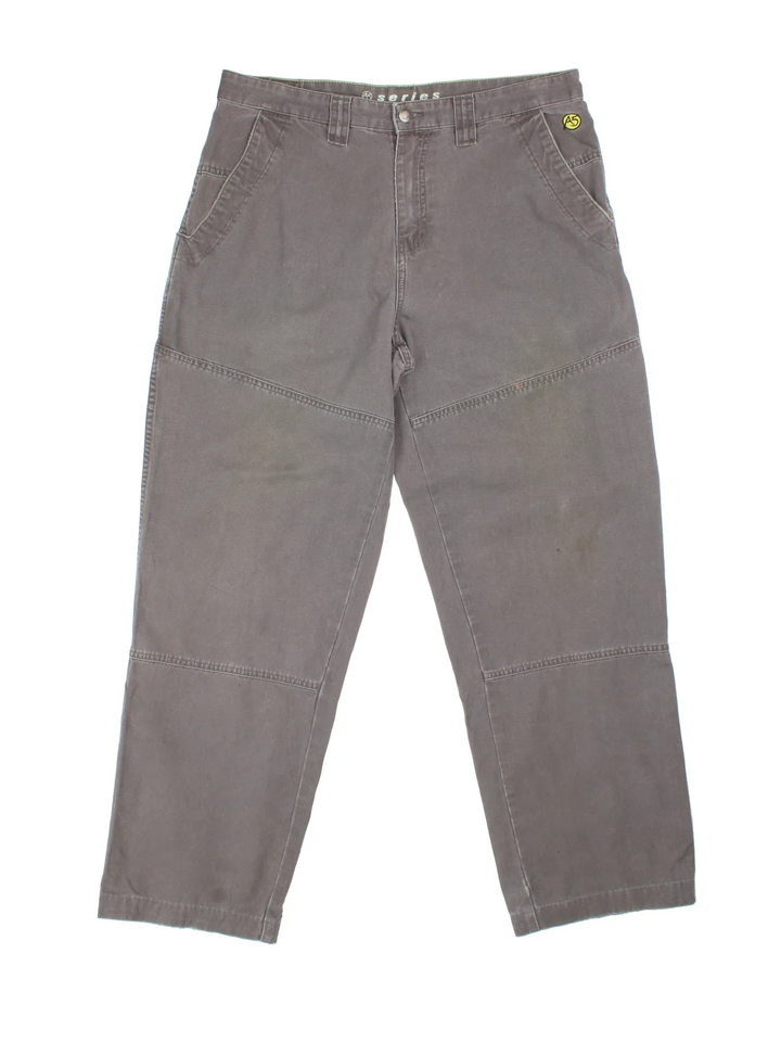 The North Face Double Knee Work Trousers in grey colourway with multiple pockets and the logo embroidered on the front.
