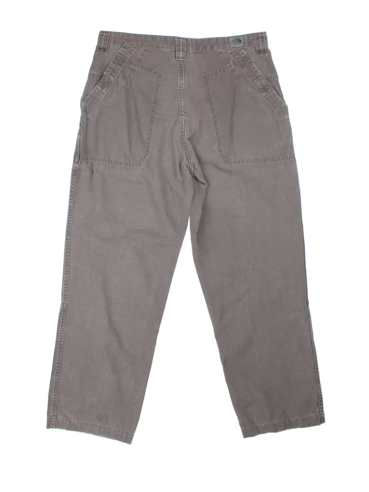 The North Face Double Knee Work Trousers in grey colourway with multiple pockets and the logo embroidered on the front.