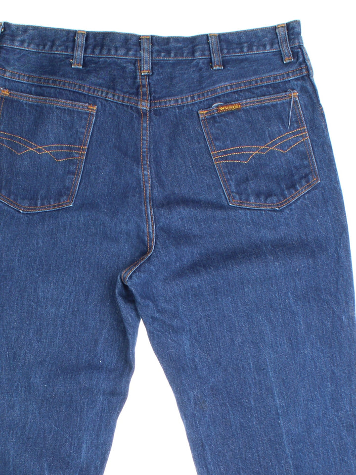 Wrangler Jeans in blue colourway. Zip fly fastening with side/back pockets and embroidered patch branding.