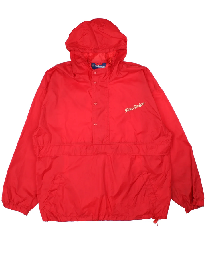 Vintage Red Stripe Jamaican Beer Windbreaker Anorak Jacket in a red colourway. Half zip and button up closure, has multiple pockets, hooded, and has the spell out logo embroidered on the front.