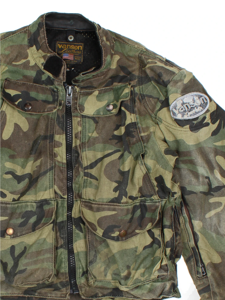 Vintage Vanson Quad Runner Camo Motorcycle Jacket in a green colourway. Zips up and has multiple pockets, and the logos embroidered on the sleeves and back.