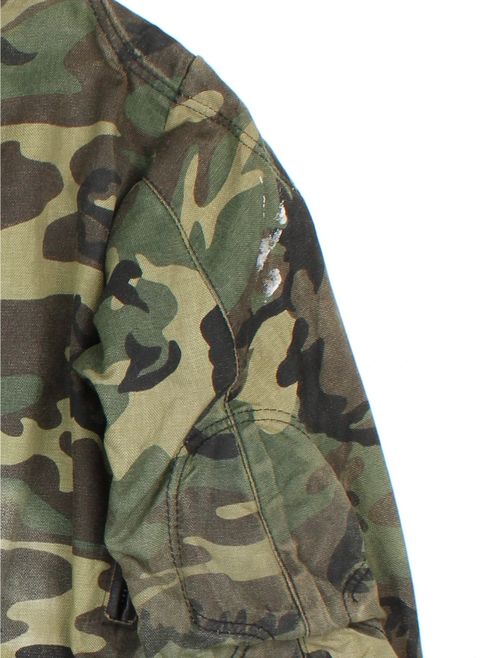 Vintage Vanson Quad Runner Camo Motorcycle Jacket in a green colourway. Zips up and has multiple pockets, and the logos embroidered on the sleeves and back.
