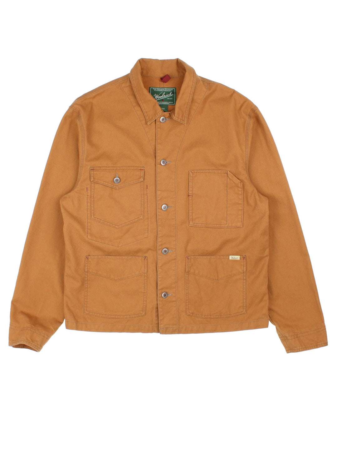 Woolrich Chore Work Jacket in a brown colourway. Buttons up and has multiple pockets, and the logo tab embroidered on the front.