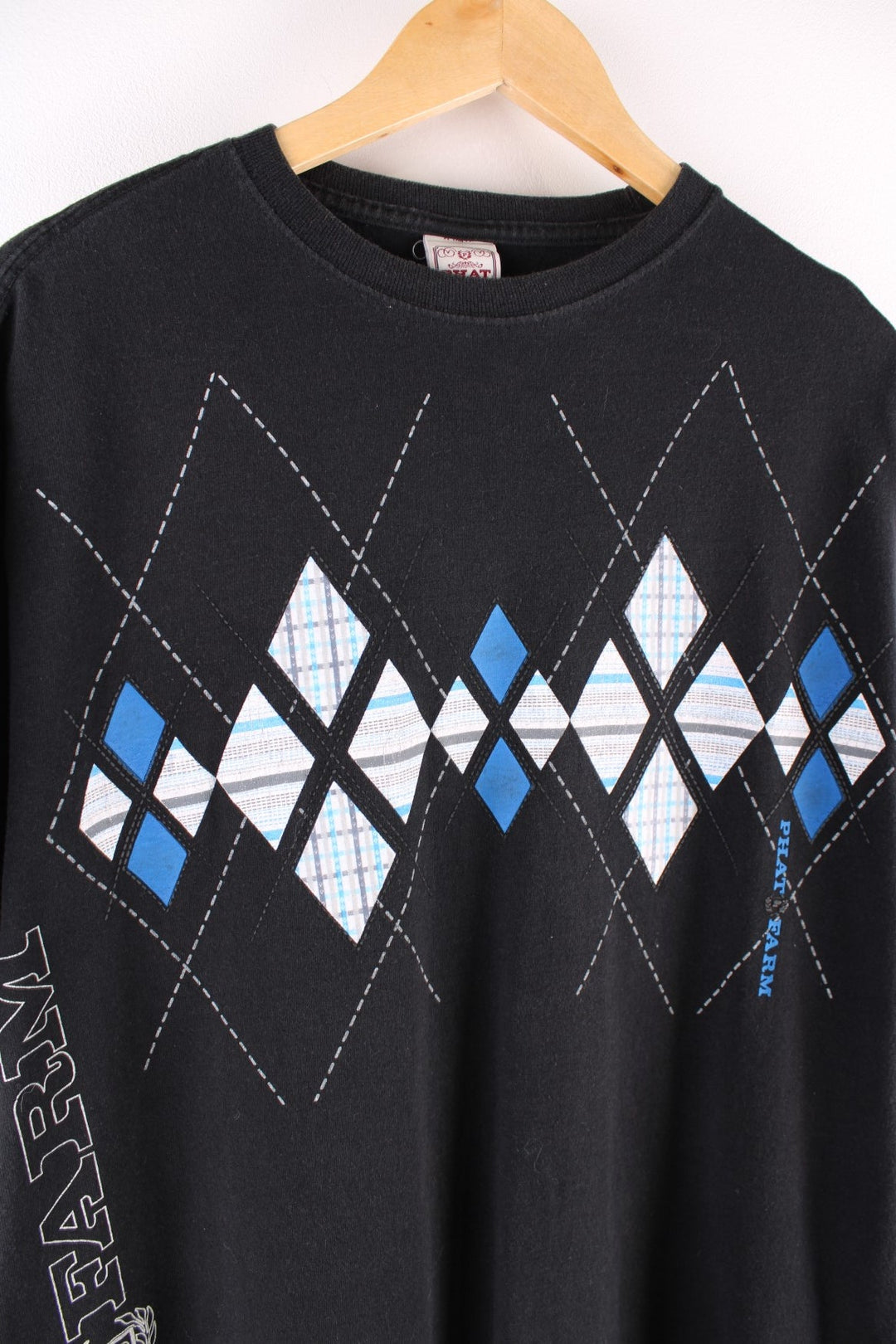 Vintage Phat Farm t-shirt in black with a blue and white argyle print, and a logo up the right side.