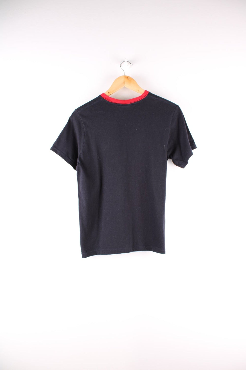 90's Ralph Lauren Polo Jeans Co. v-neck t-shirt in navy blue with red accents and spell out logo embroidered across the front.