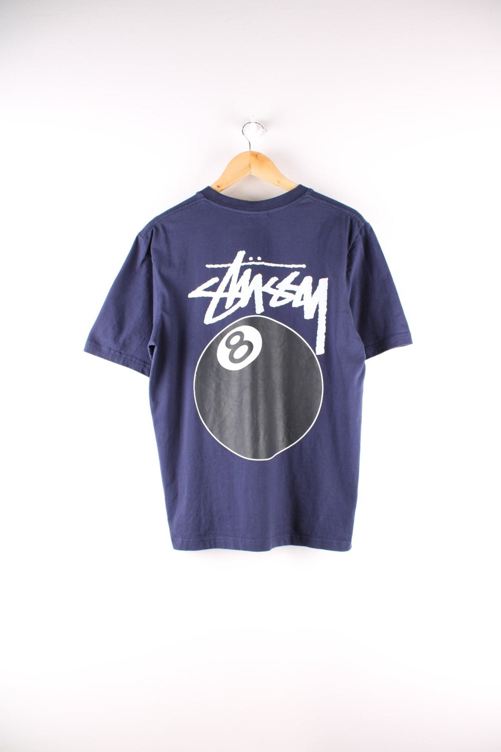 Stussy 8 Ball t-shirt in navy blue with printed logo and 8 ball graphic on the front and back.