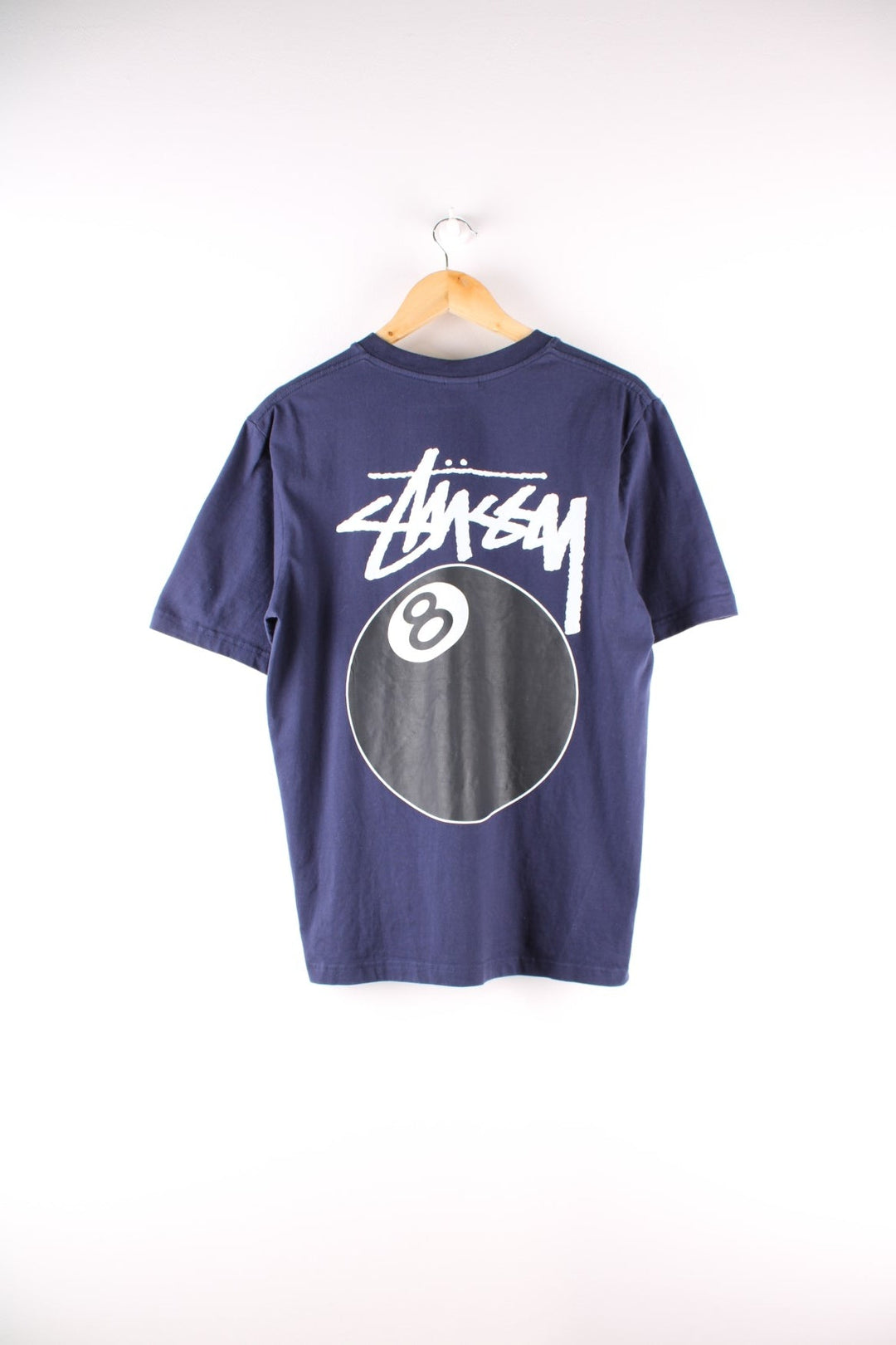 Stussy 8 Ball t-shirt in navy blue with printed logo and 8 ball graphic on the front and back.