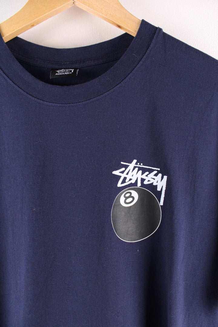 Stussy 8 Ball t-shirt in navy blue with printed logo and 8 ball graphic on the front and back.