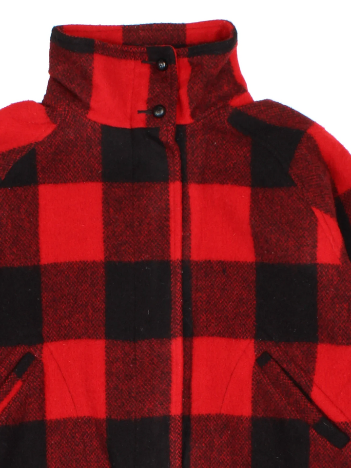 Vintage Woolrich Cropped Woollen Flannel CPO Coat in a red and black colourway. Zips up and has side pockets, and all over plaid pattern.
