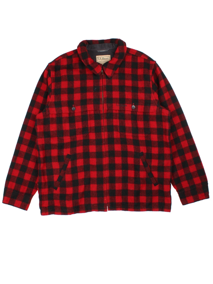 L.L Bean Woollen Flannel CPO Coat in a red and black colourway. Buttons up and has multiple pockets, and all over checked pattern with the logo embroidered on the front.
