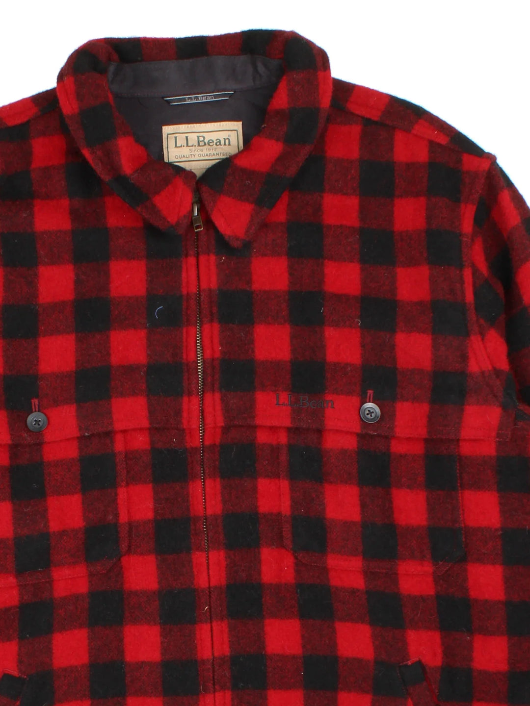 L.L Bean Woollen Flannel CPO Coat in a red and black colourway. Buttons up and has multiple pockets, and all over checked pattern with the logo embroidered on the front.