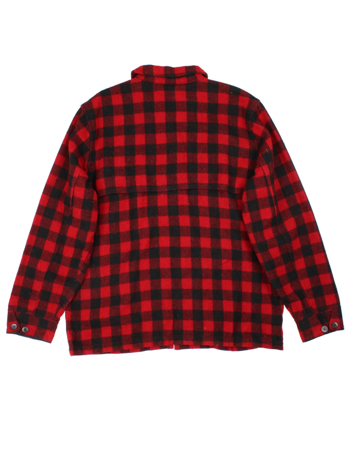 L.L Bean Woollen Flannel CPO Coat in a red and black colourway. Buttons up and has multiple pockets, and all over checked pattern with the logo embroidered on the front.