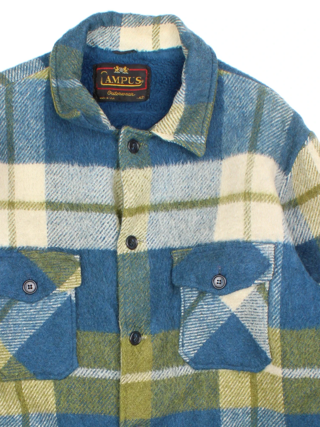 Vintage 70's Campus Woollen Plaid CPO Coat in a blue, green and white colourway. Buttons up and has multiple pockets, and all over plaid pattern.