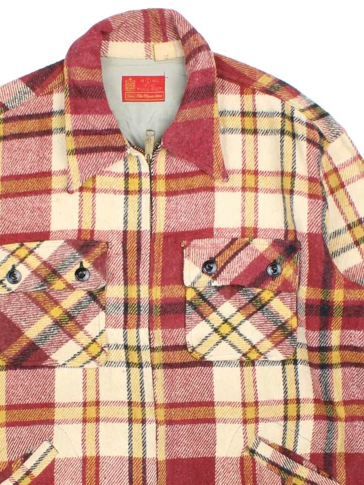 Vintage Sears Woollen Plaid Flannel CPO Coat in a red, beige and yellow colourway. Buttons up and has multiple pockets, and all over plaid pattern.