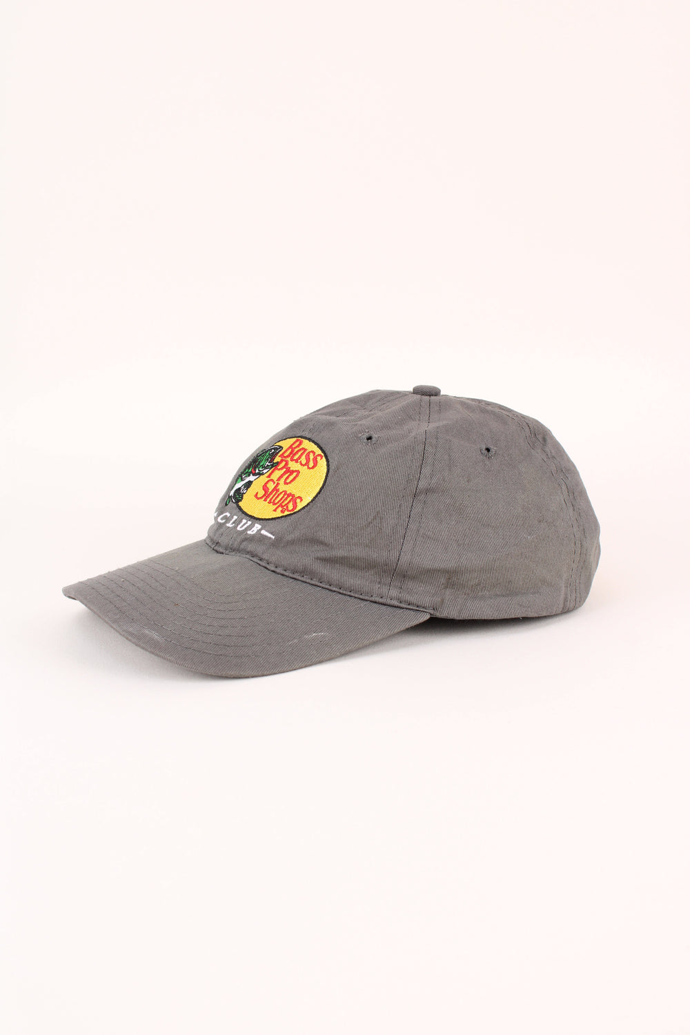 Vintage Bass Pro Shops Club Cap in a grey colourway with the logo embroidered on the front, and has adjustable strap on the back.