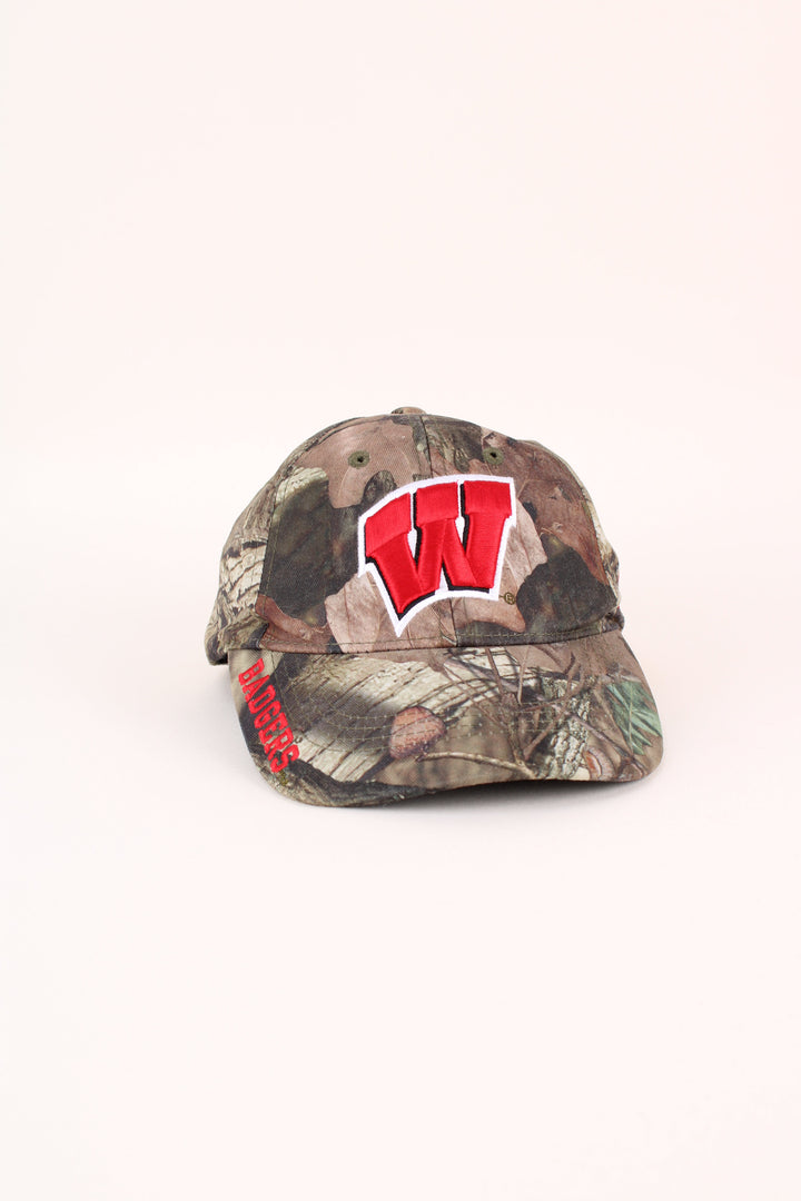 Vintage Wisconsin Badgers Camo Cap in a green colourway with the logo embroidered on the front, and has adjustable velcro strap.