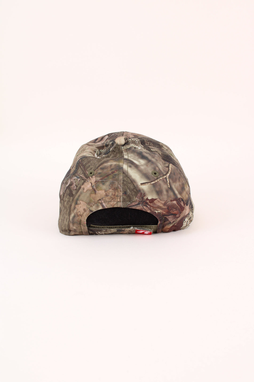 Vintage Wisconsin Badgers Camo Cap in a green colourway with the logo embroidered on the front, and has adjustable velcro strap.