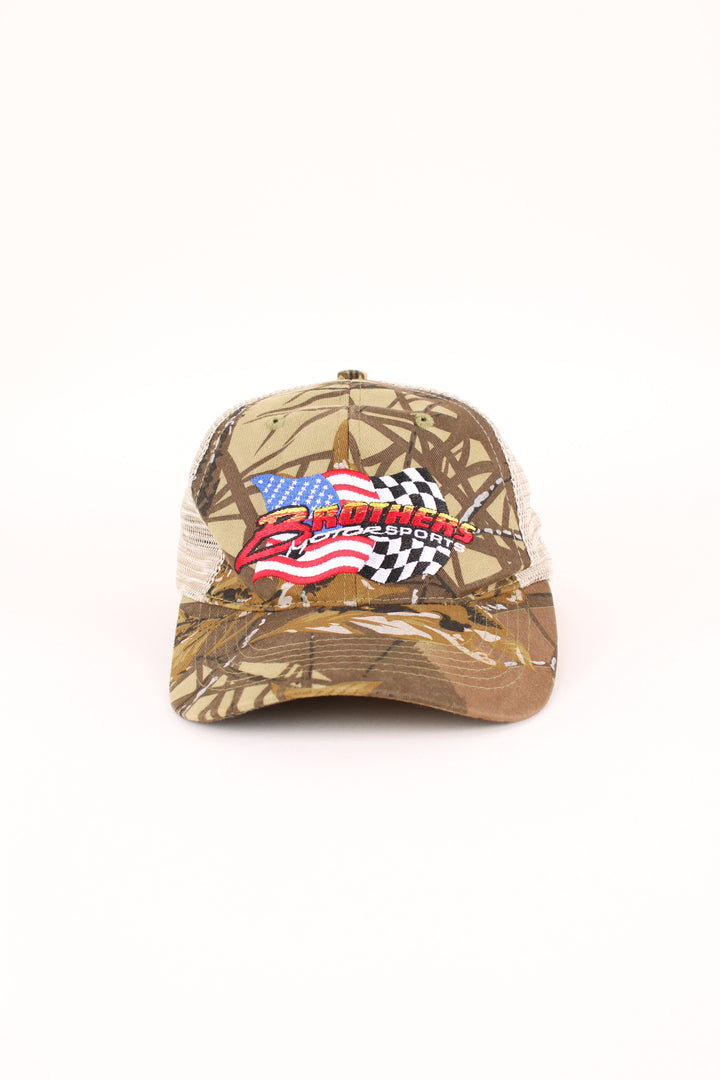 Vintage Brothers Motorsports Camo Trucker Cap in a green colourway with the logo embroidered on the front, mesh panelling. and has adjustable velcro strap at the back.