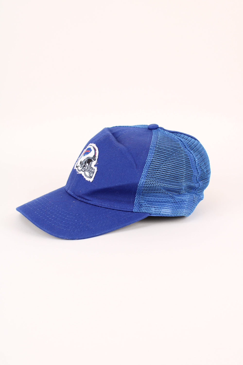 Buffalo Bills NFL Trucker Cap in a blue colourway with the logo embroidered on the front, mesh panelling, and has adjustable strap at the back.