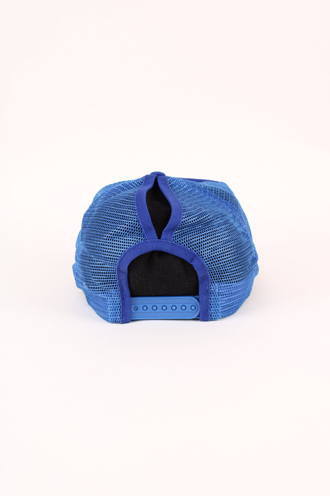 Buffalo Bills NFL Trucker Cap in a blue colourway with the logo embroidered on the front, mesh panelling, and has adjustable strap at the back.