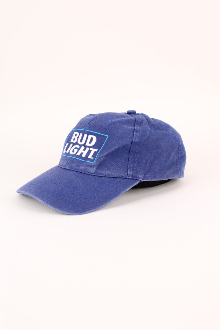 Vintage Bud Light Cap in a blue colourway with the logo embroidered on the front, and has adjustable velcro strap at the back.