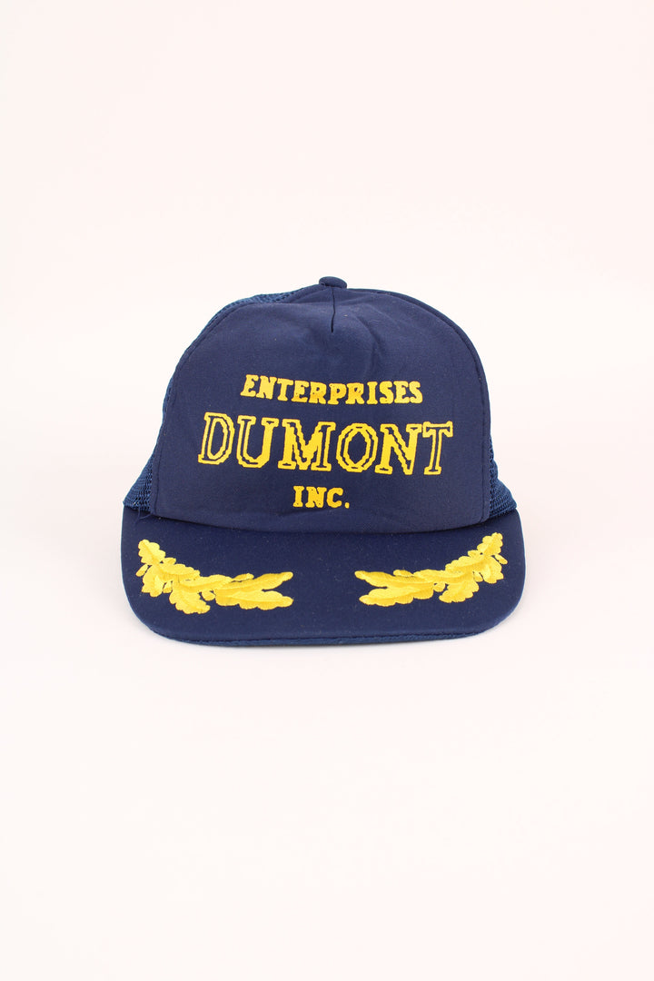 Vintage Enterprise Dumont Trucker Cap in a blue colourway with the logo embroidered on the front, mesh lining, and has adjustable velcro snapback.