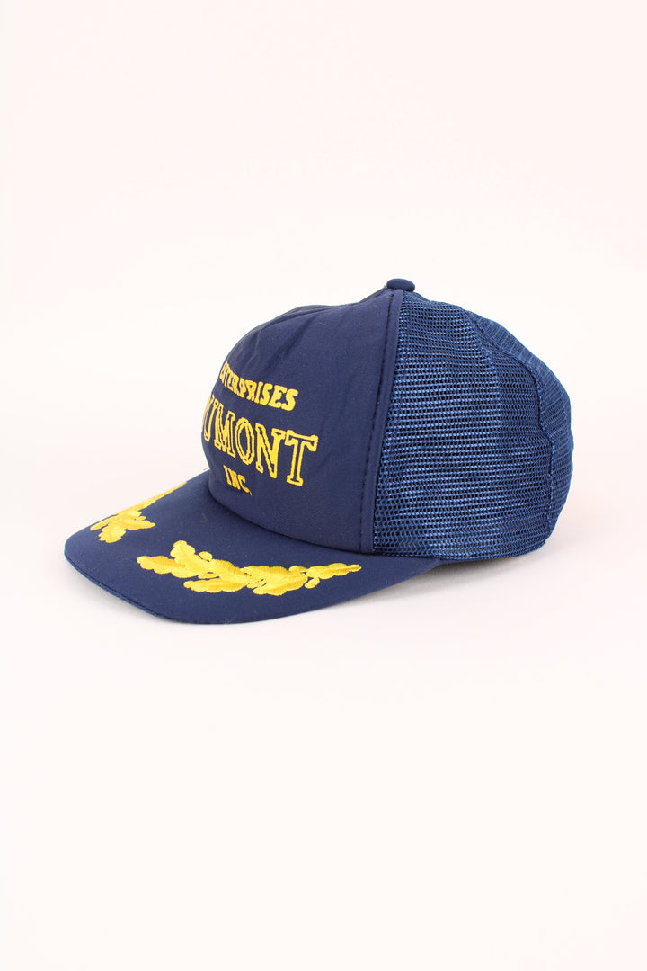 Vintage Enterprise Dumont Trucker Cap in a blue colourway with the logo embroidered on the front, mesh lining, and has adjustable velcro snapback.