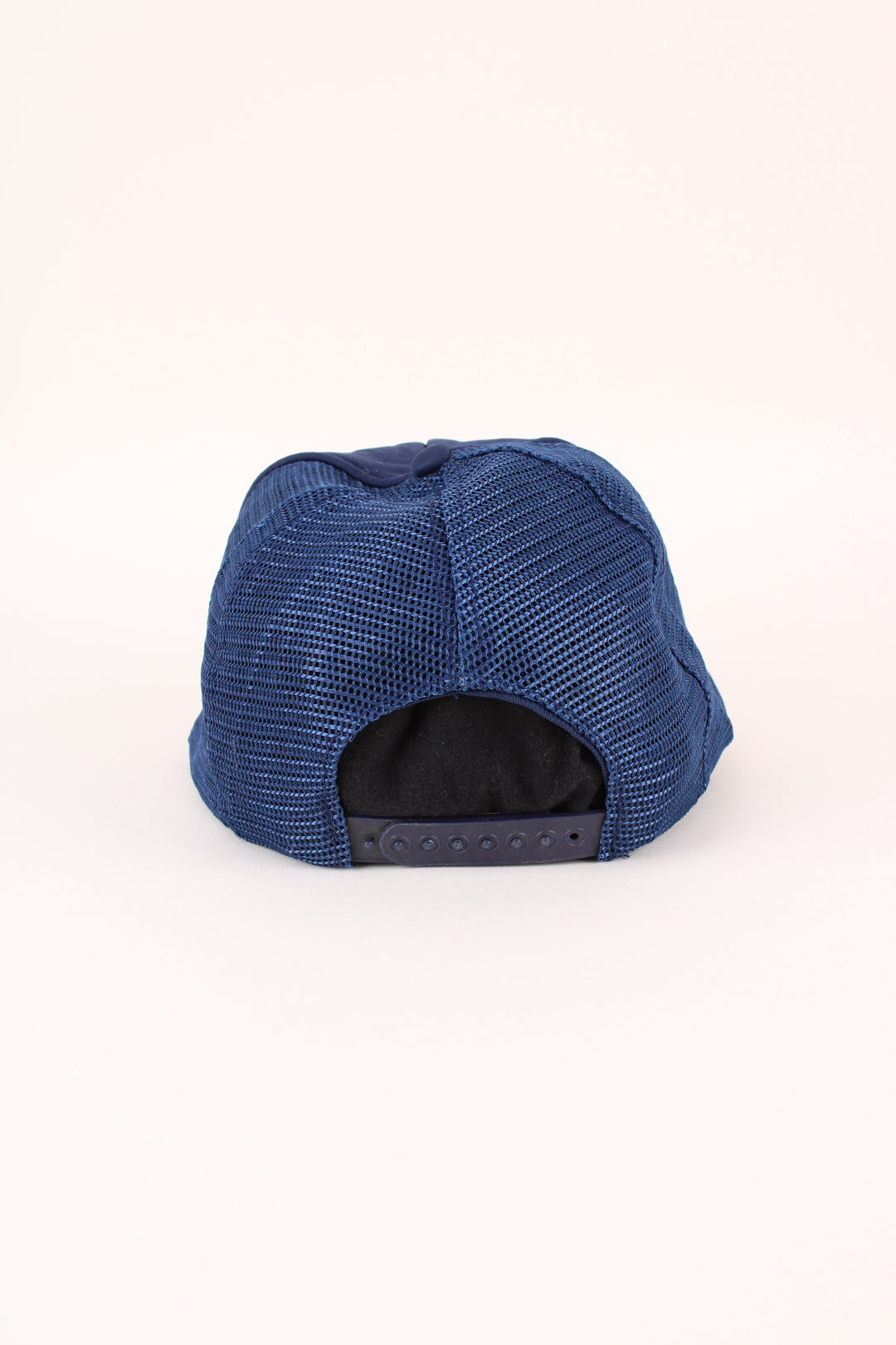 Vintage Enterprise Dumont Trucker Cap in a blue colourway with the logo embroidered on the front, mesh lining, and has adjustable velcro snapback.