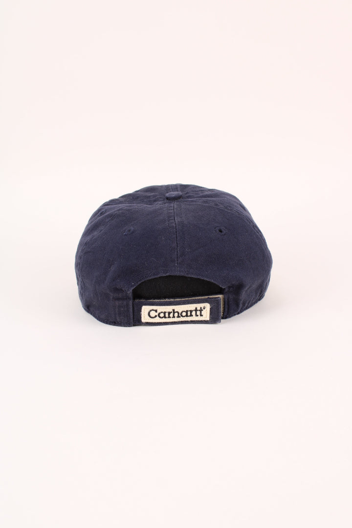 Carhartt 1989 Cap in a blue colourway with the logo embroidered on the front, and has adjustable velcro strap at the back.