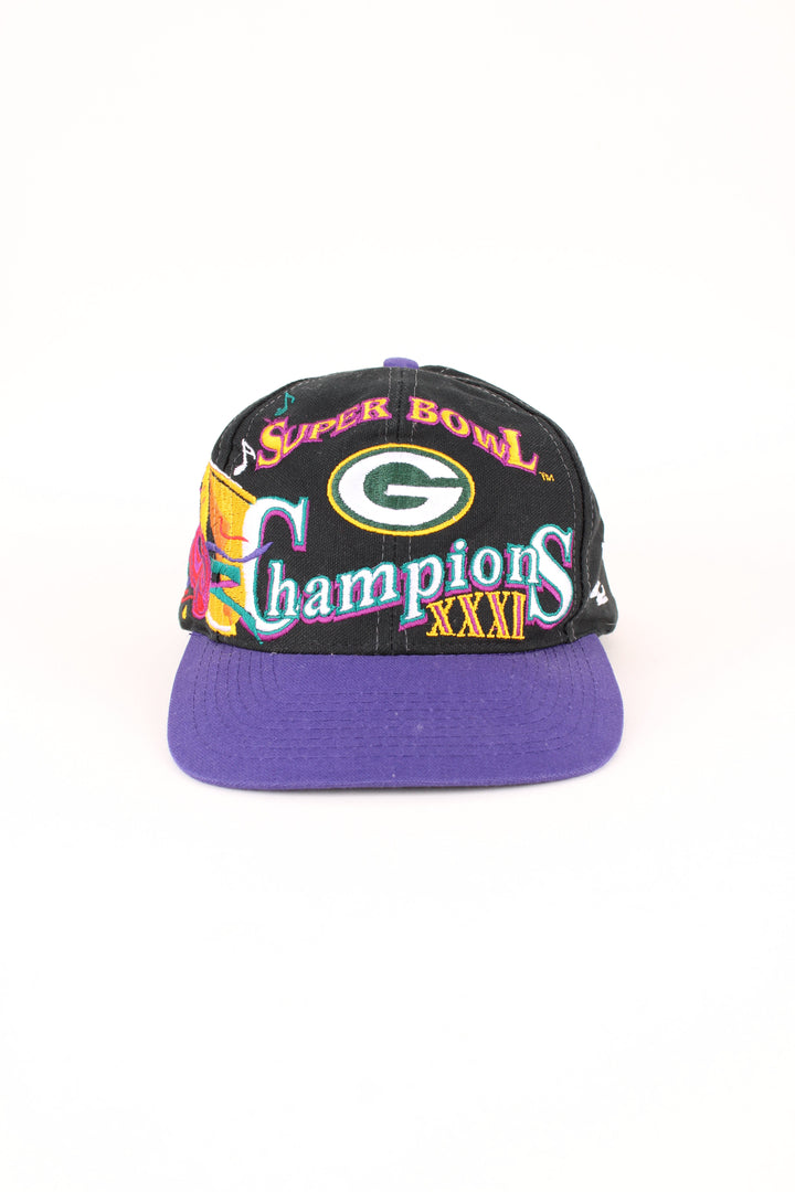 1997 Green Bay Packers NFL Super Bowl Champions Cap in a black and purple colourway with the logo embroidered on the front/back, and has adjustable snapback.