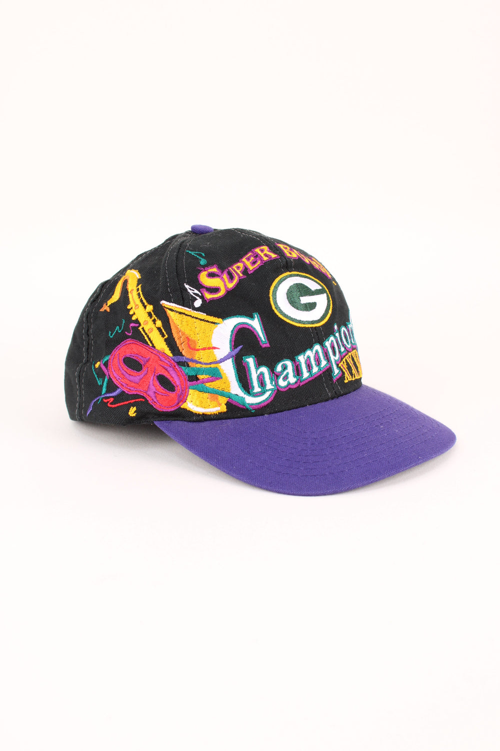 1997 Green Bay Packers NFL Super Bowl Champions Cap in a black and purple colourway with the logo embroidered on the front/back, and has adjustable snapback.