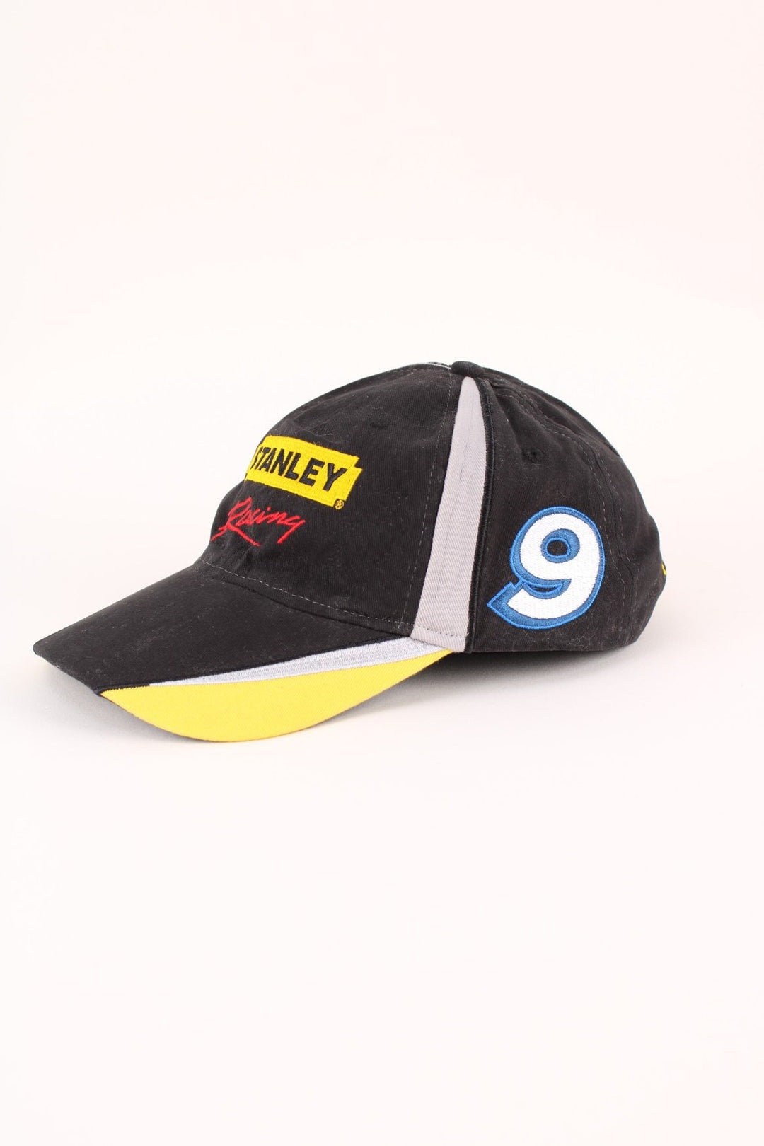 Stanley Nascar Racing Cap in a black colourway with the logo embroidered on the front/sides, and has adjustable strap at the back.