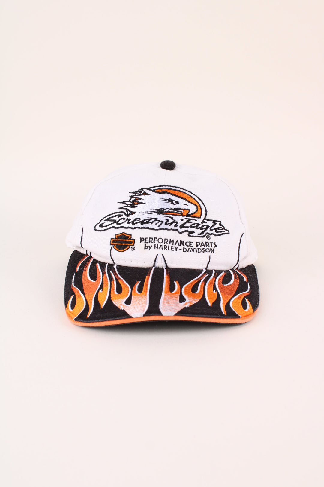 Harley-Davidson Screamin Eagle Cap in a white and black colourway with the logo embroidered on the front/back, and has adjustable strap at the back.