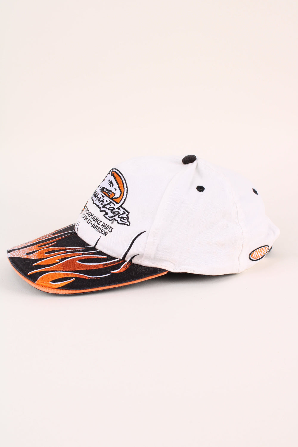 Harley-Davidson Screamin Eagle Cap in a white and black colourway with the logo embroidered on the front/back, and has adjustable strap at the back.