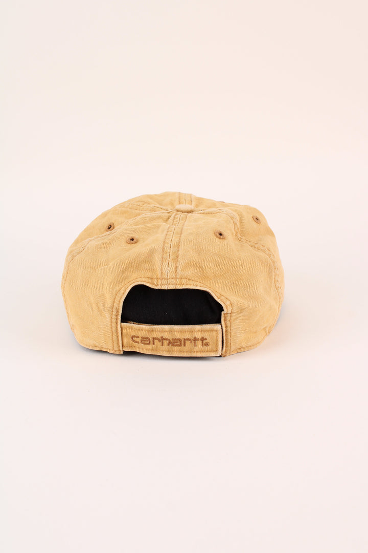 Carhartt Cap in a tan colourway with the logo embroidered on the front, and has adjustable velcro strap at the back.