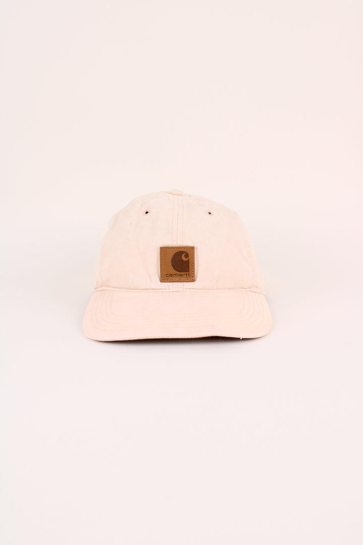Carhartt Cap in a tan colourway with the logo embroidered on the front, and has adjustable velcro strap at the back.