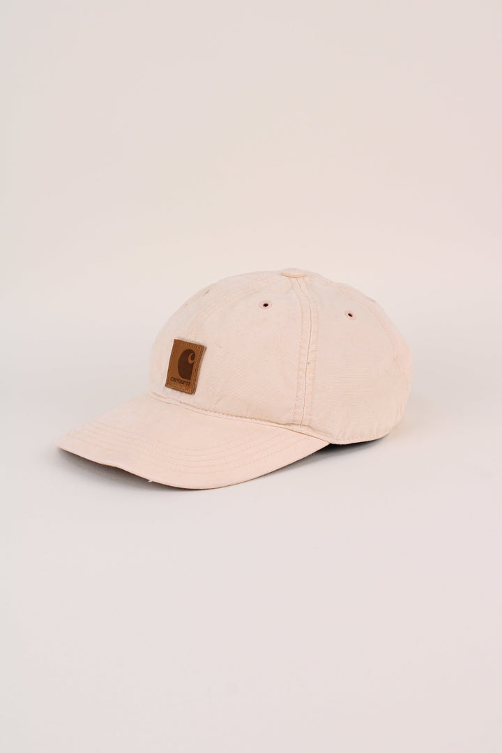 Carhartt Cap in a tan colourway with the logo embroidered on the front, and has adjustable velcro strap at the back.